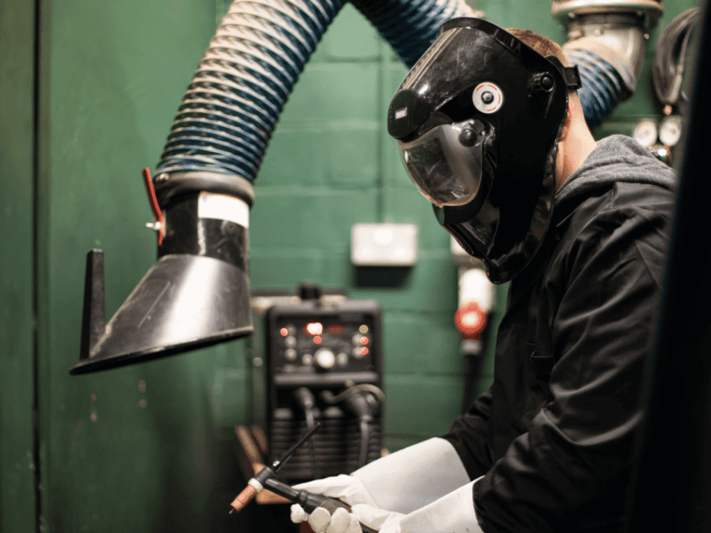 Using welding tools.