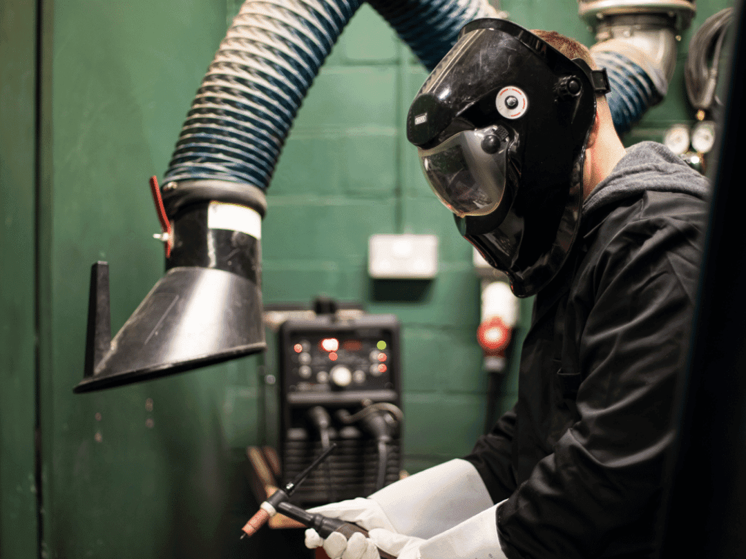 Using welding tools.