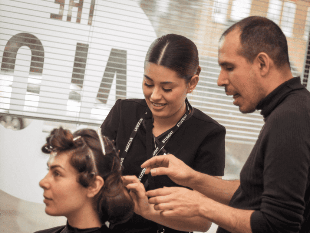 Learner working on a hairstyle at The Salon.