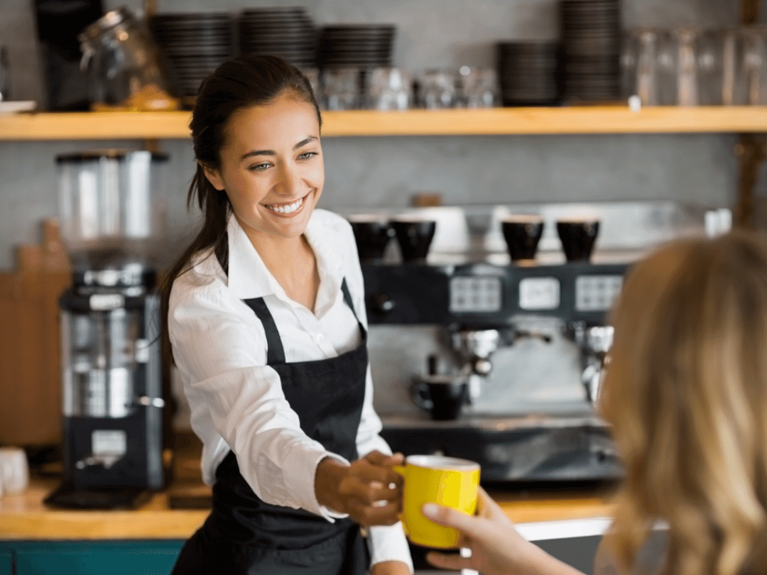 Serving someone a coffee.