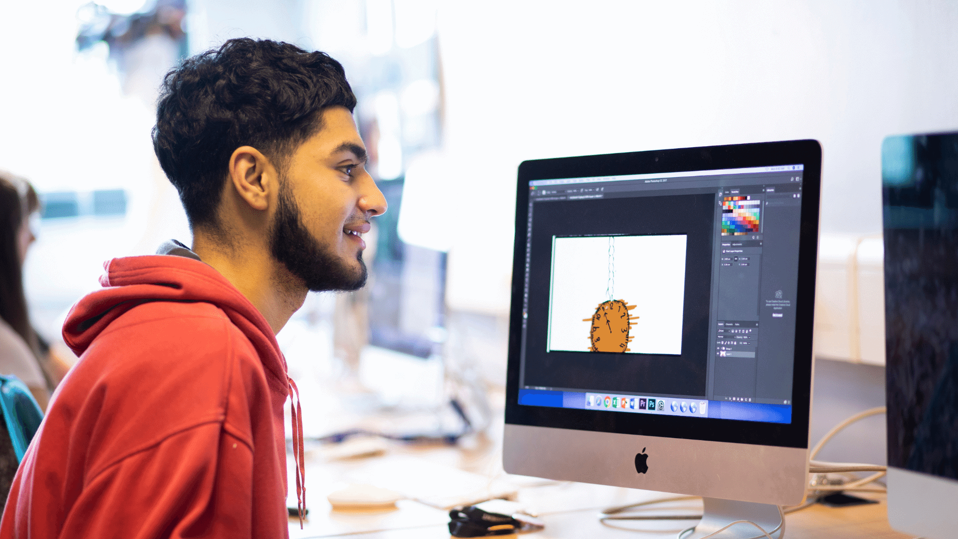 Student doing art on computer.