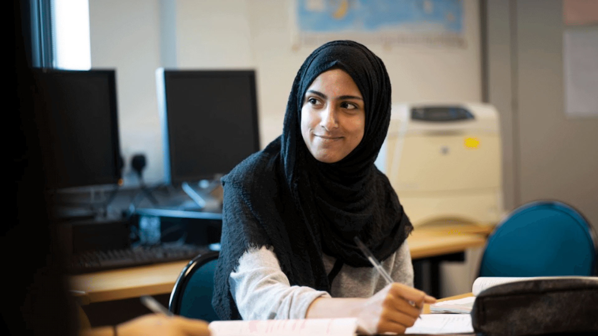 Student learning at desk.