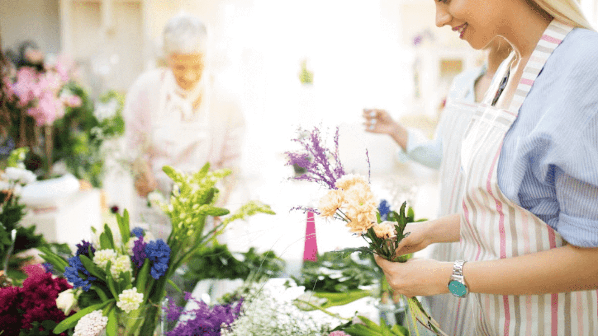 Student making flower arrangement.