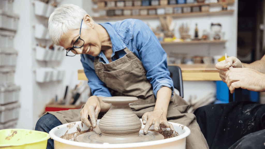 Student enjoying a pottery wheel.