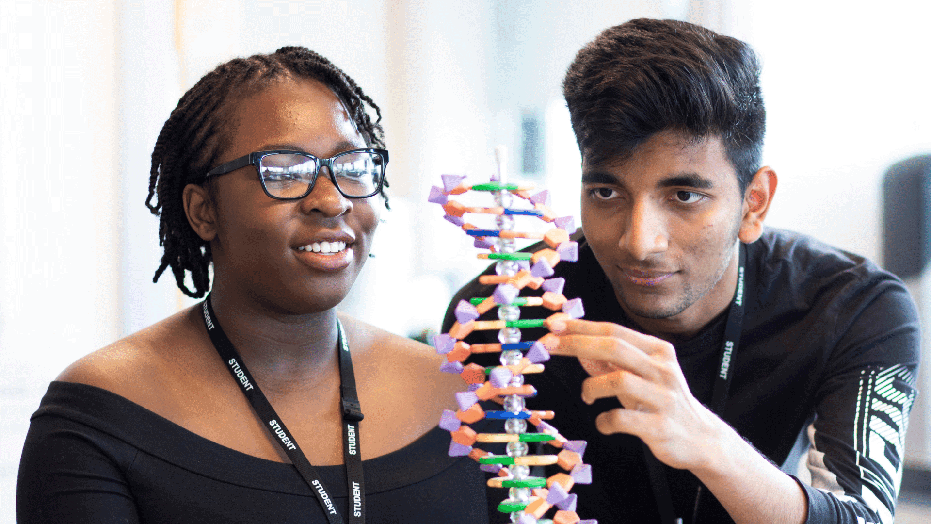 Two students learning about DNA.