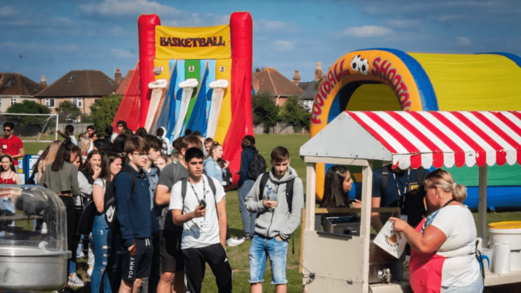 Students enjoying inflatables at the Freshers Fair.