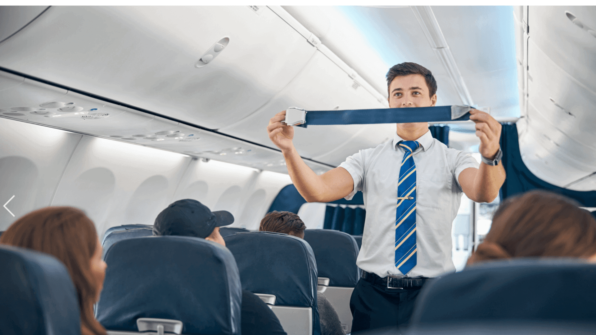 Aeroplane cabin crew doing safety brief.