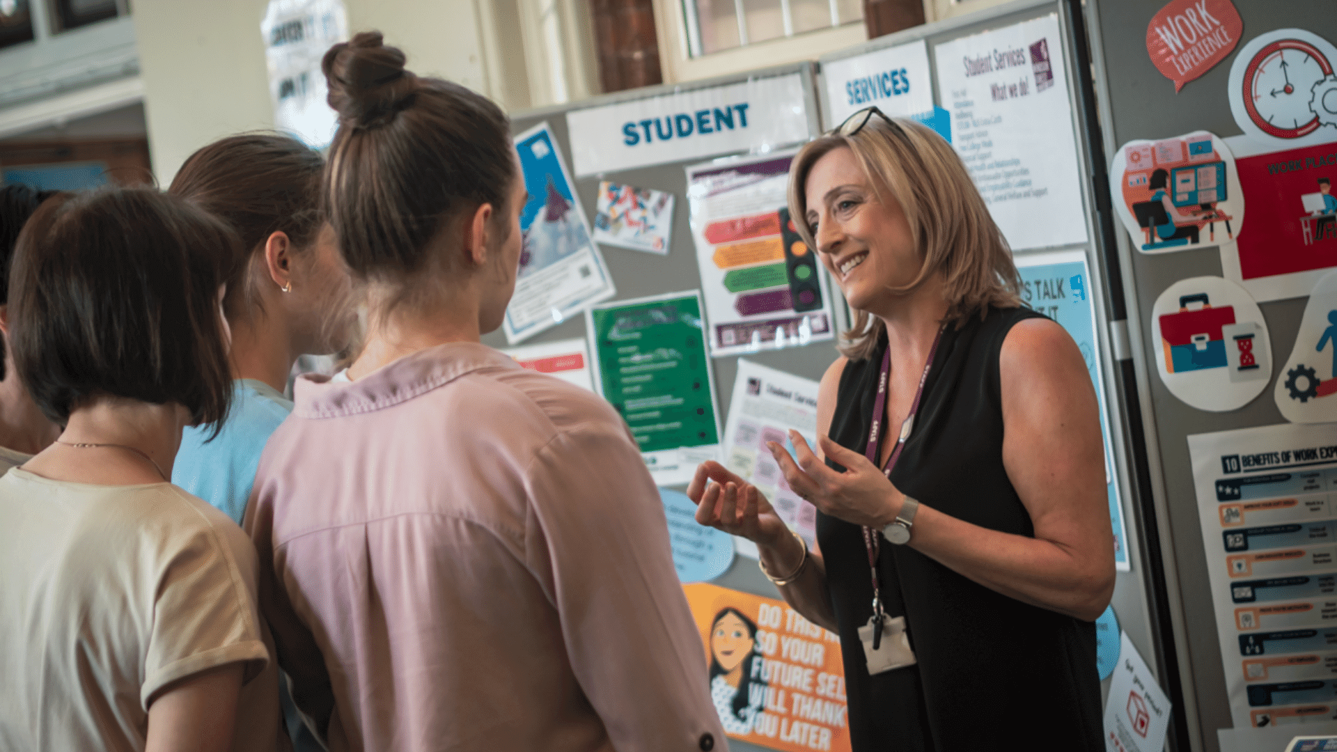 Student support staff member discussing options with students