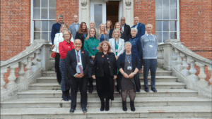 Members of the board of governors on the steps of Hall Place, BCA