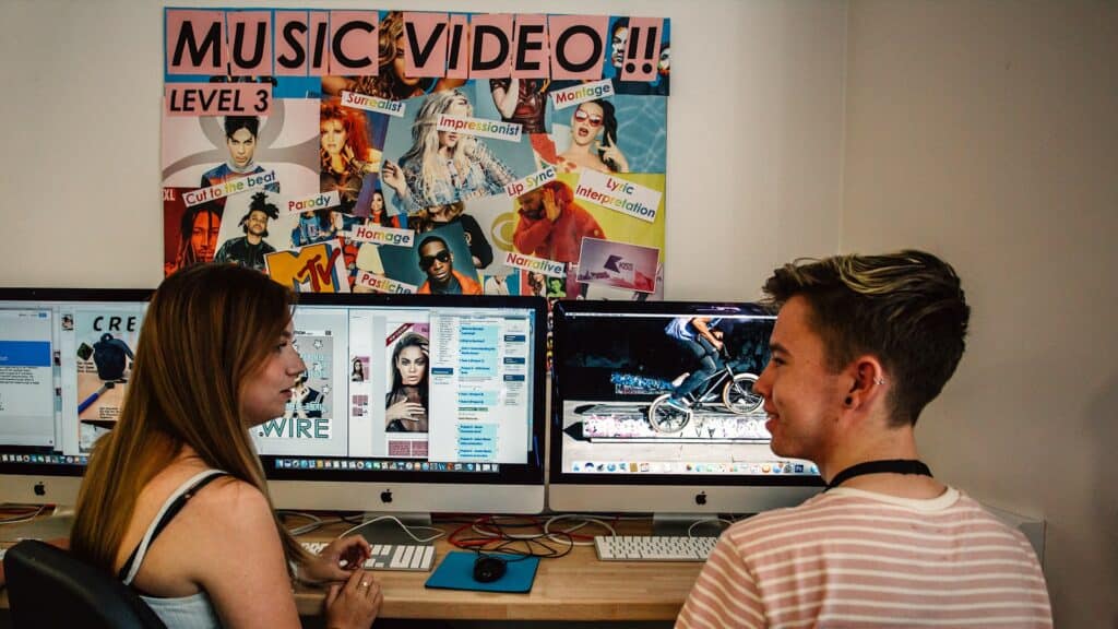 Students with music and video on computers