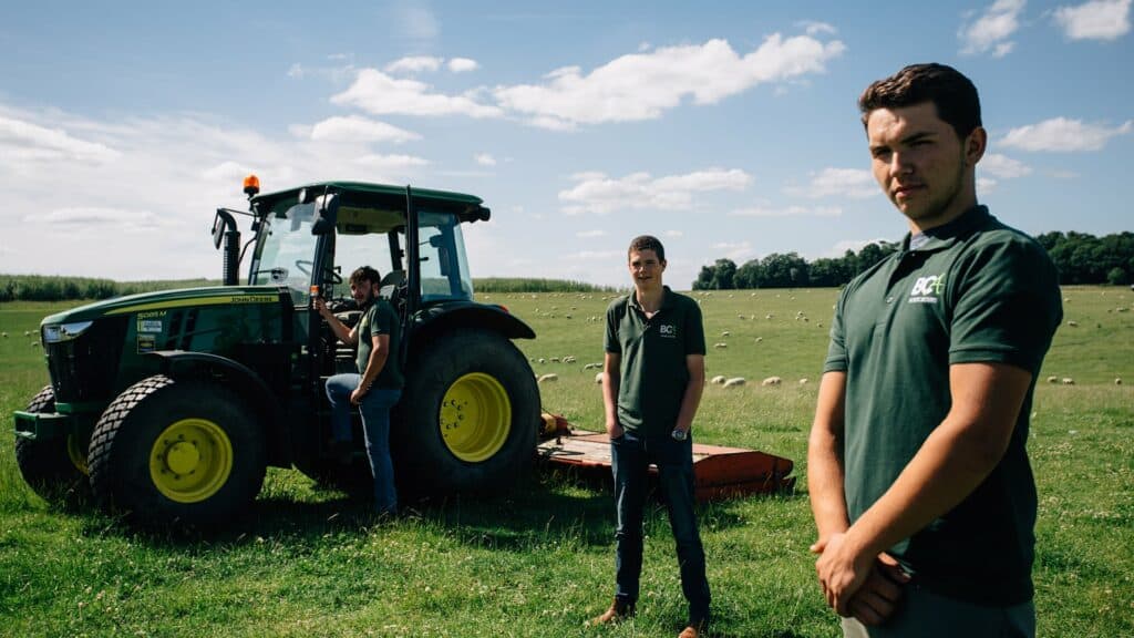 Students posing with tractor