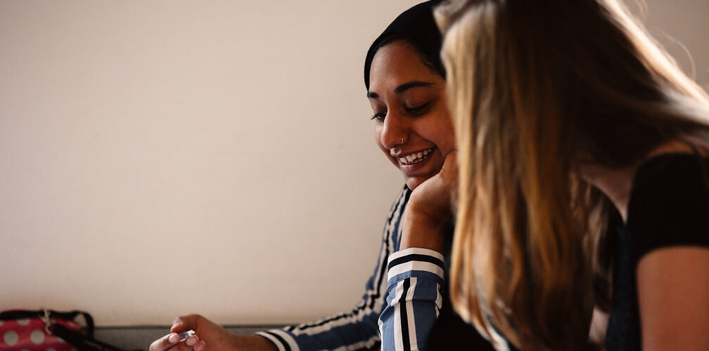 Two students sitting together