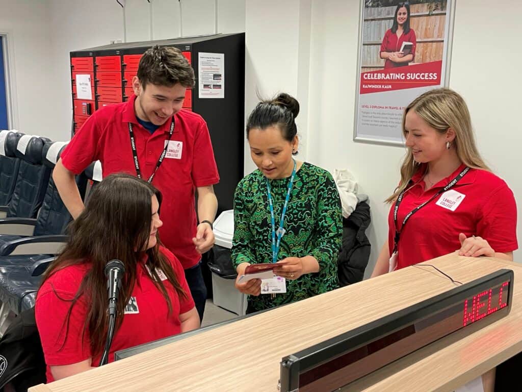 Students looking at resources with teacher