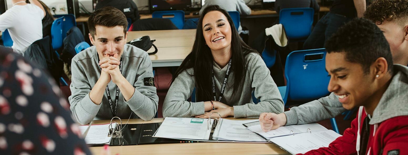 Business student laughing and enjoying lecture