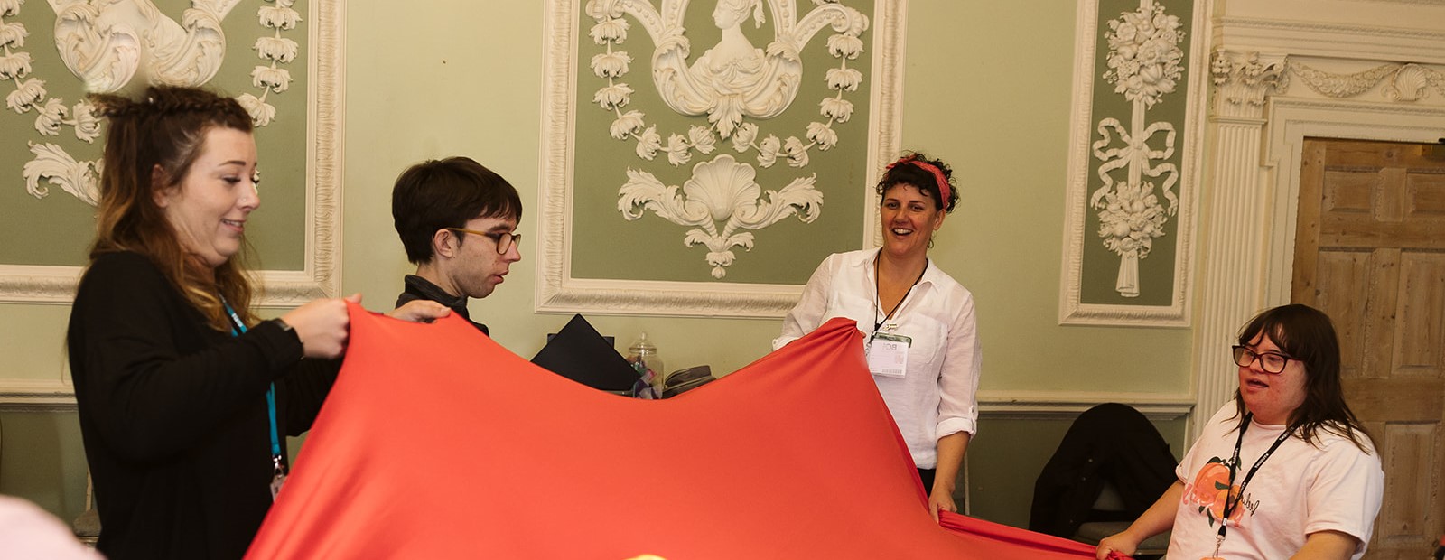 Group of ALFIE students with a red tent