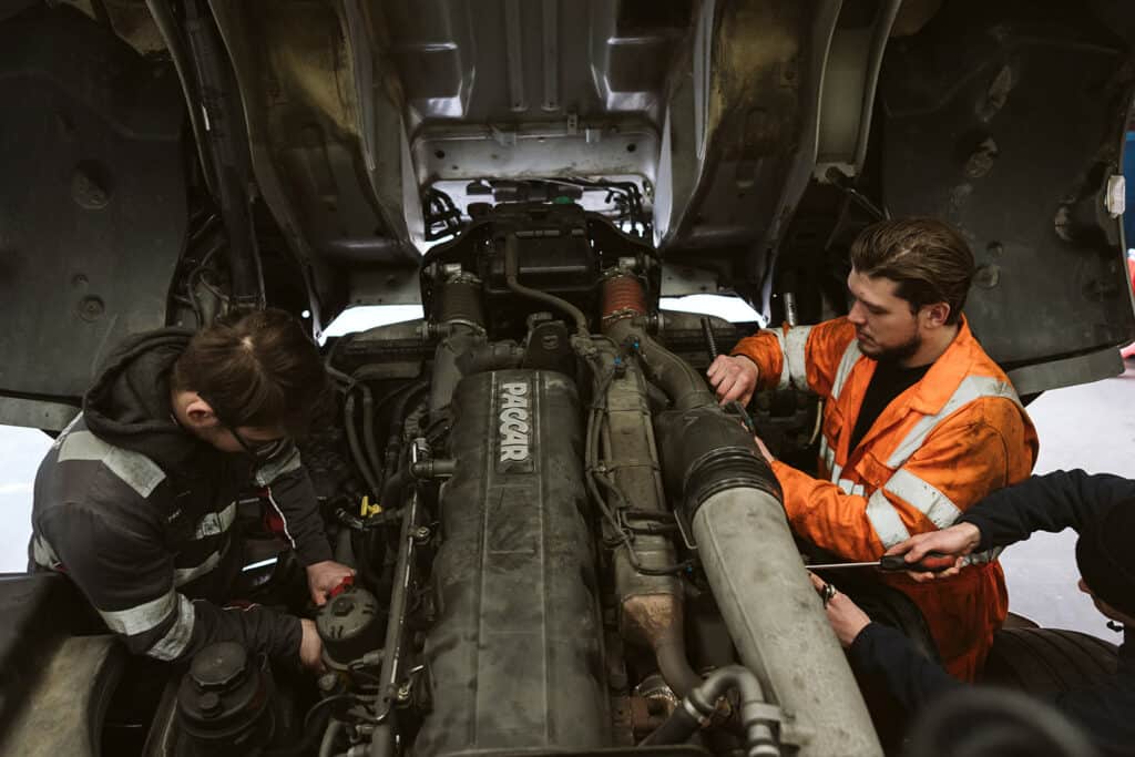 students studying car
