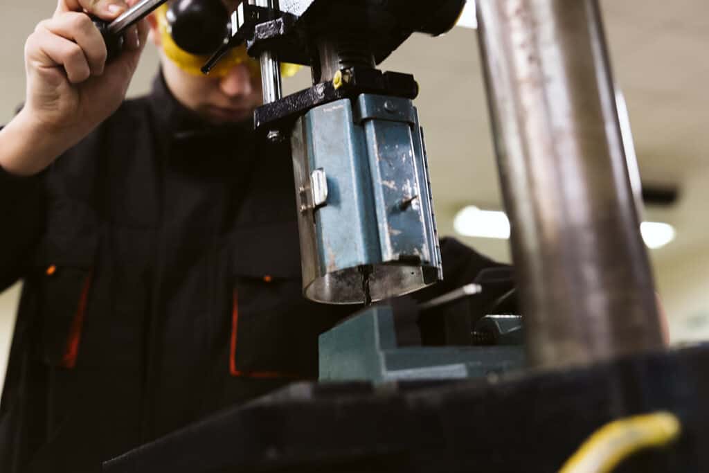 engineering student using machine
