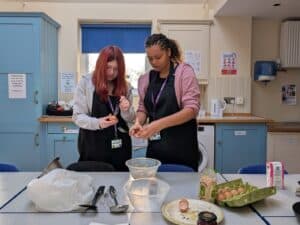 Two students cooking