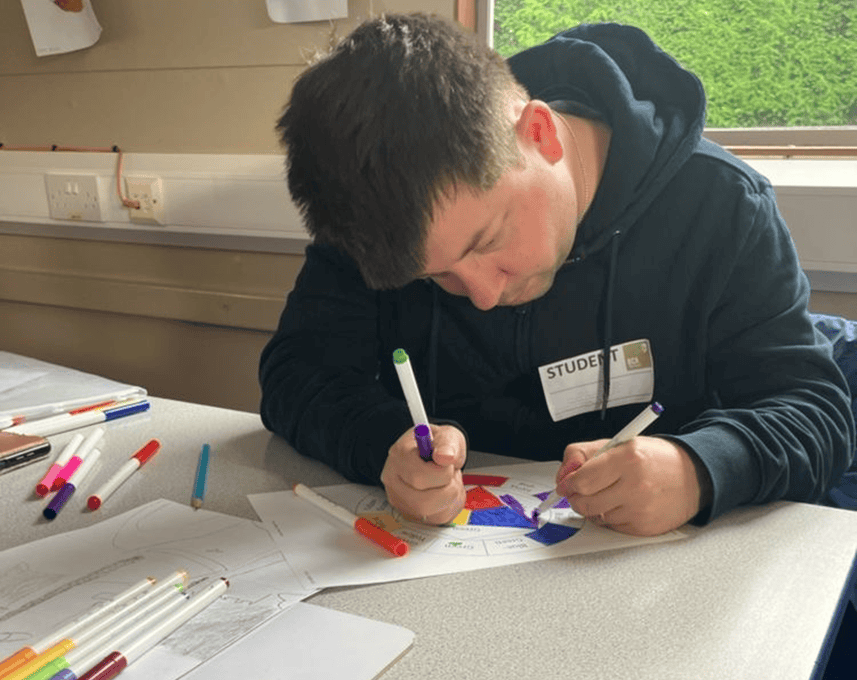 An ALFIE student colouring in