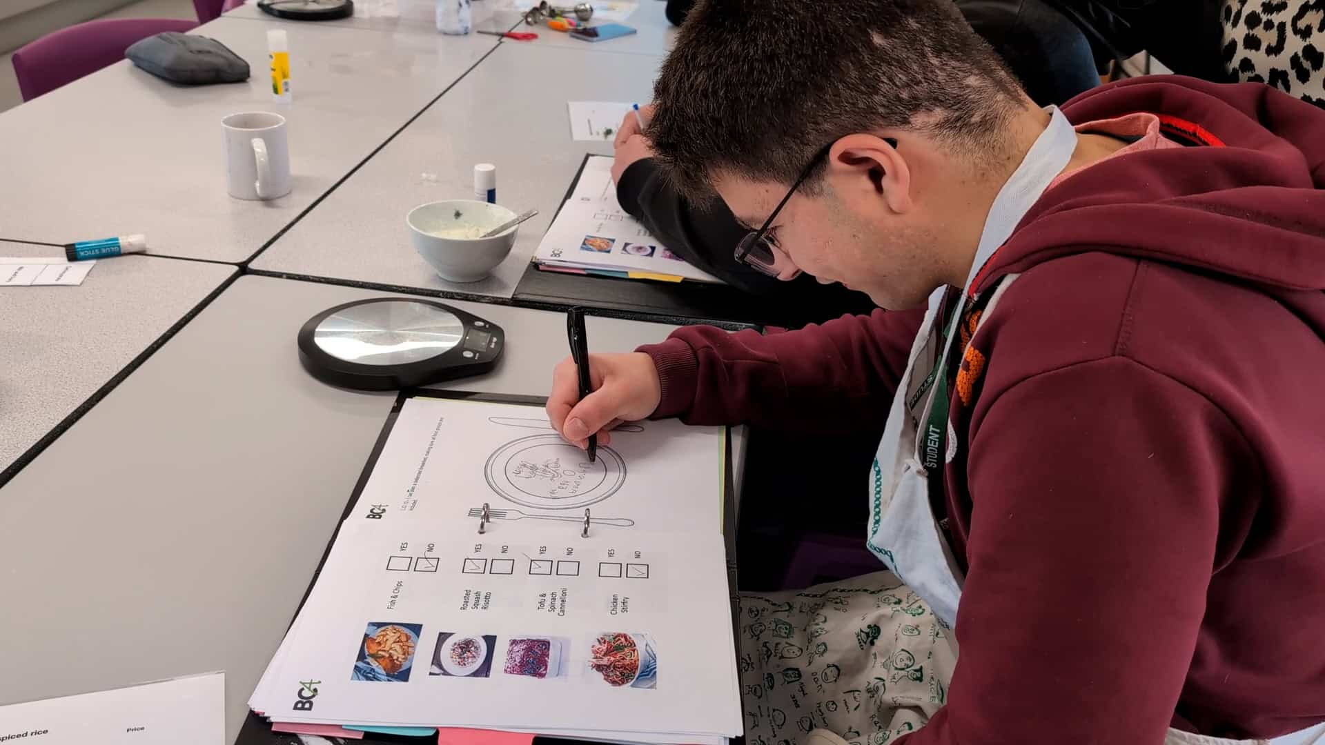 An ALFIE student drawing a balanced diet
