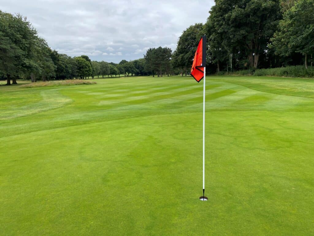 A red flag on the green at Bury St Edmunds Golf Club