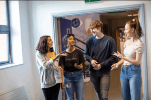 students talking in windsor college halls