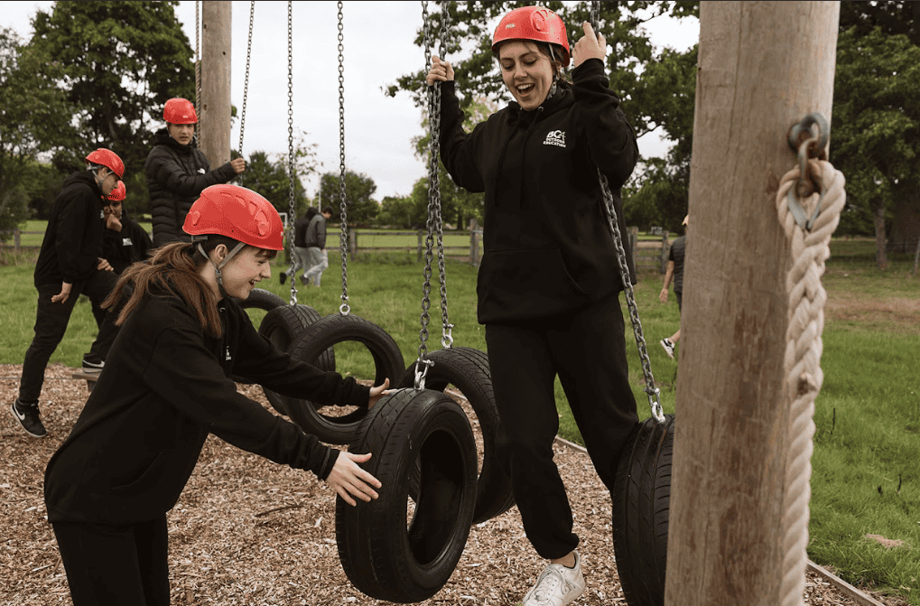 outdoor education students using equipment