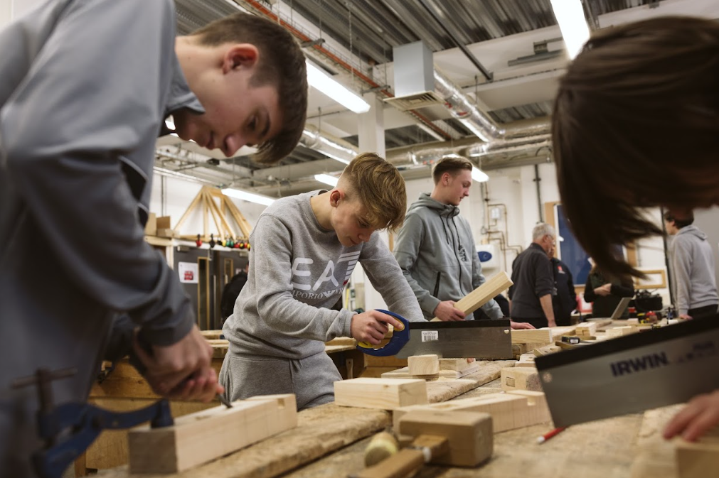 construction students using equipment