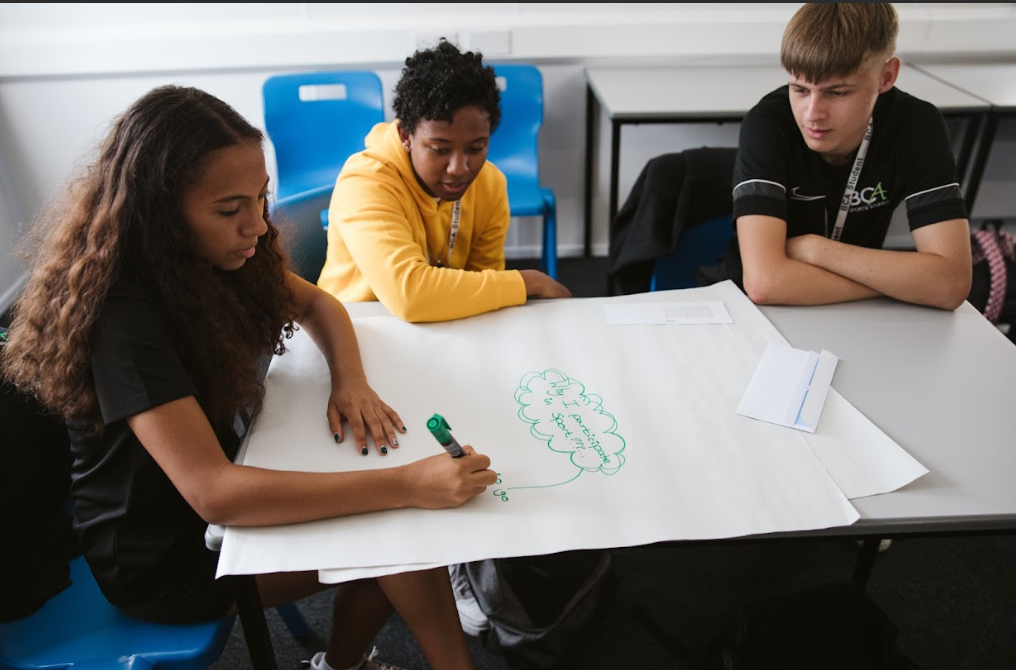 sports students writing on paper