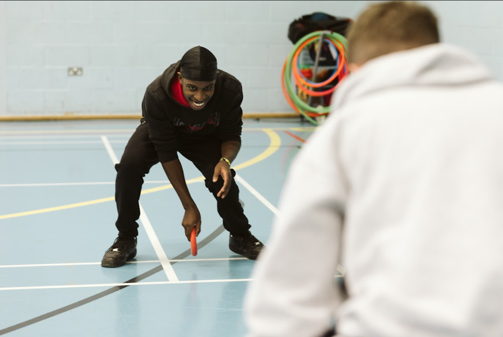 students in the sports hall playing