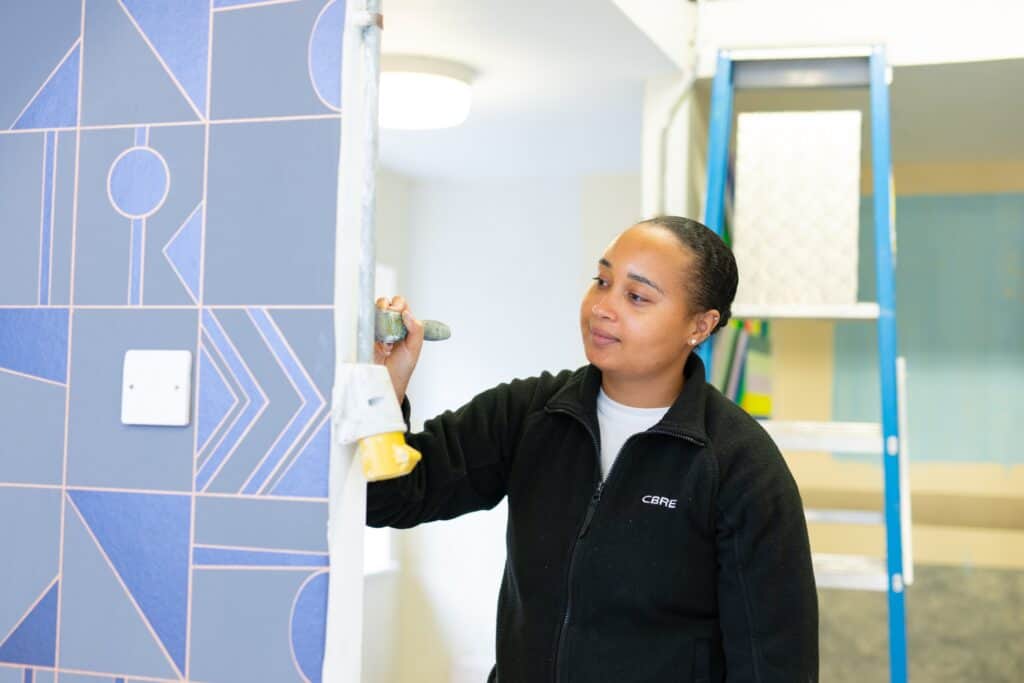 girl painting a wall