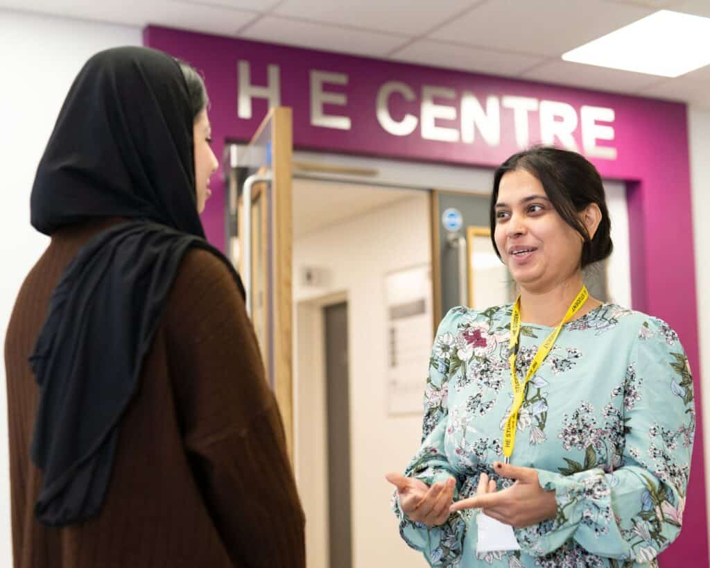 Two HE students outside the HE centre