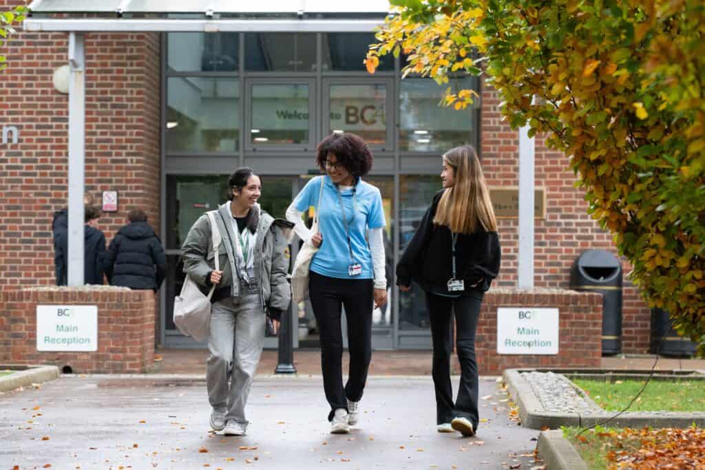 3 students in front of BCA Recpetion