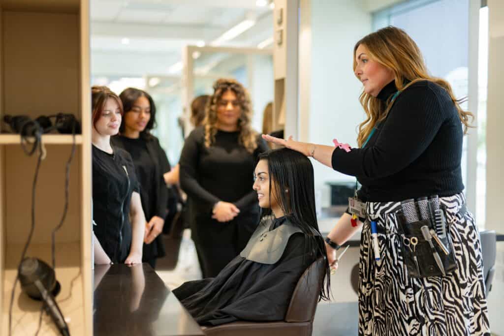 Hair teacher demonsatrating