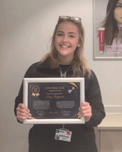 Apprentice of the Month with her certificate