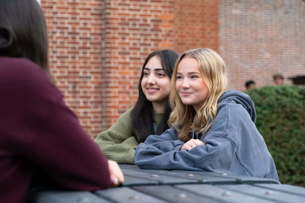 2 students at a bench
