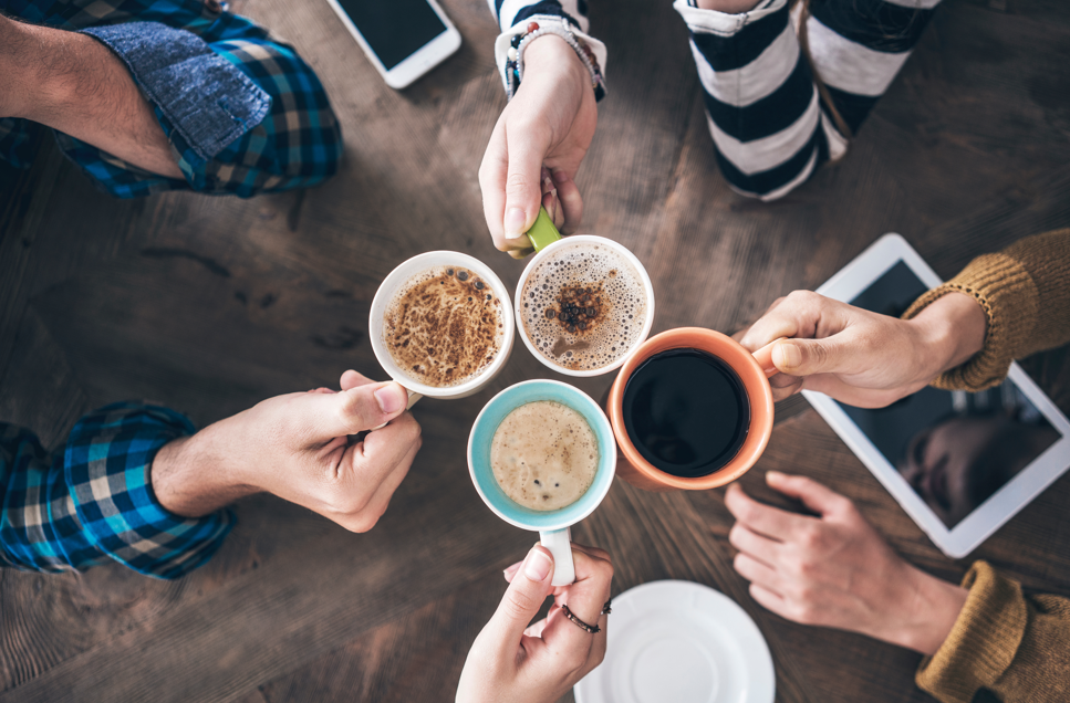 Group of people holding coffee