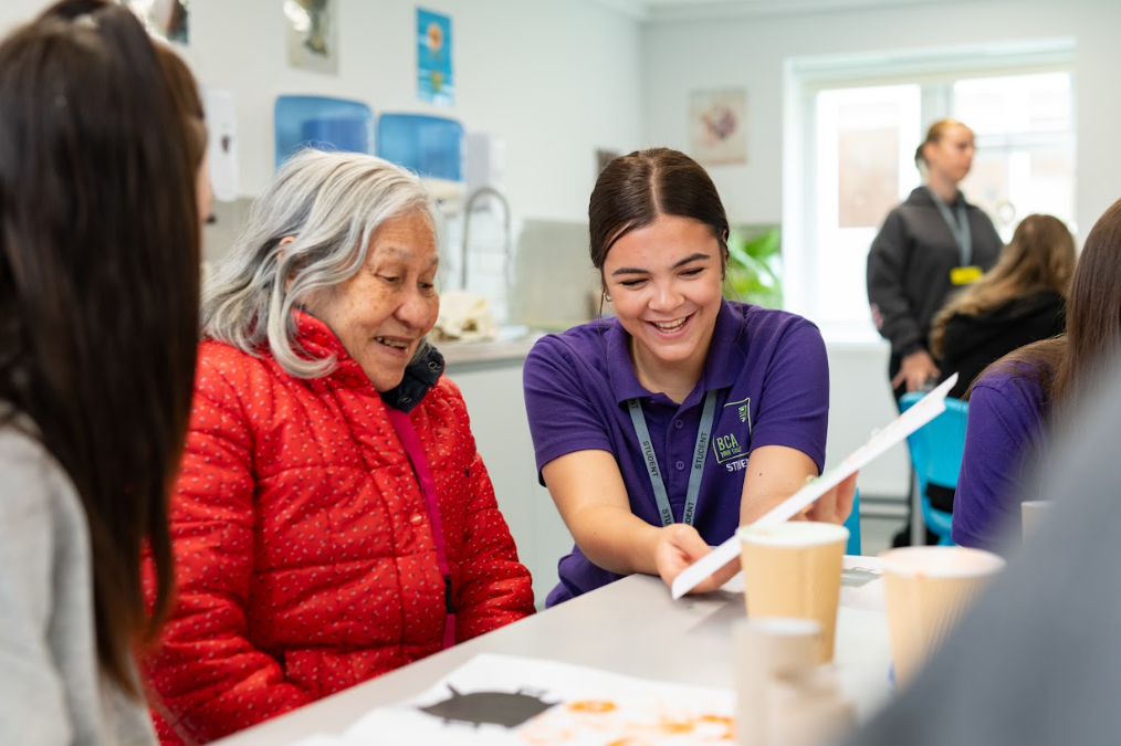 student laughing with patient