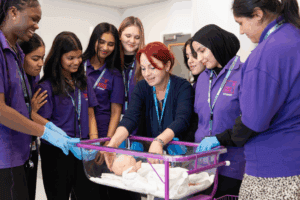 health students stood with a teacher