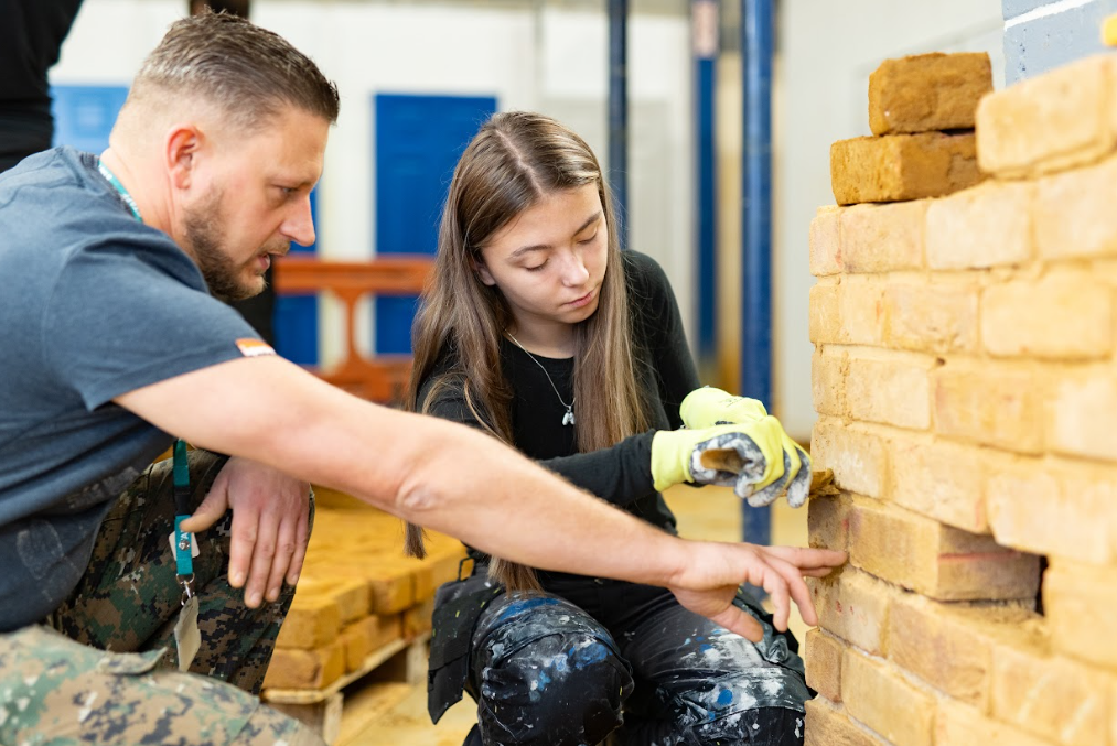 construction student with teacher