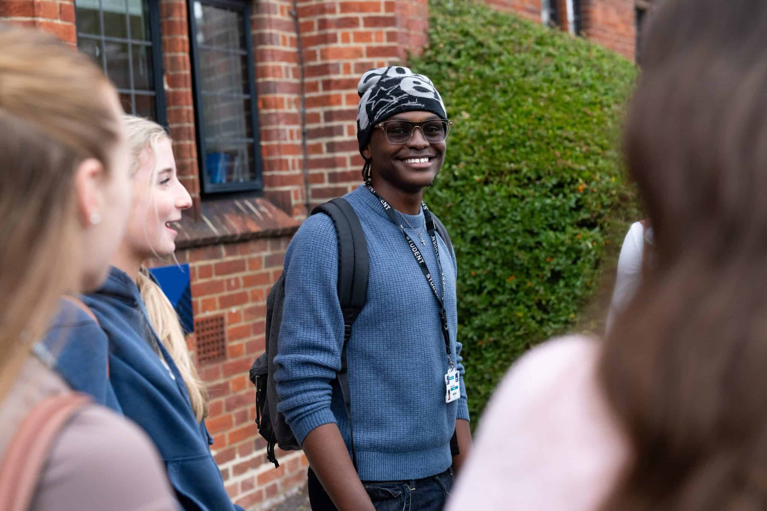 students laughing outside college