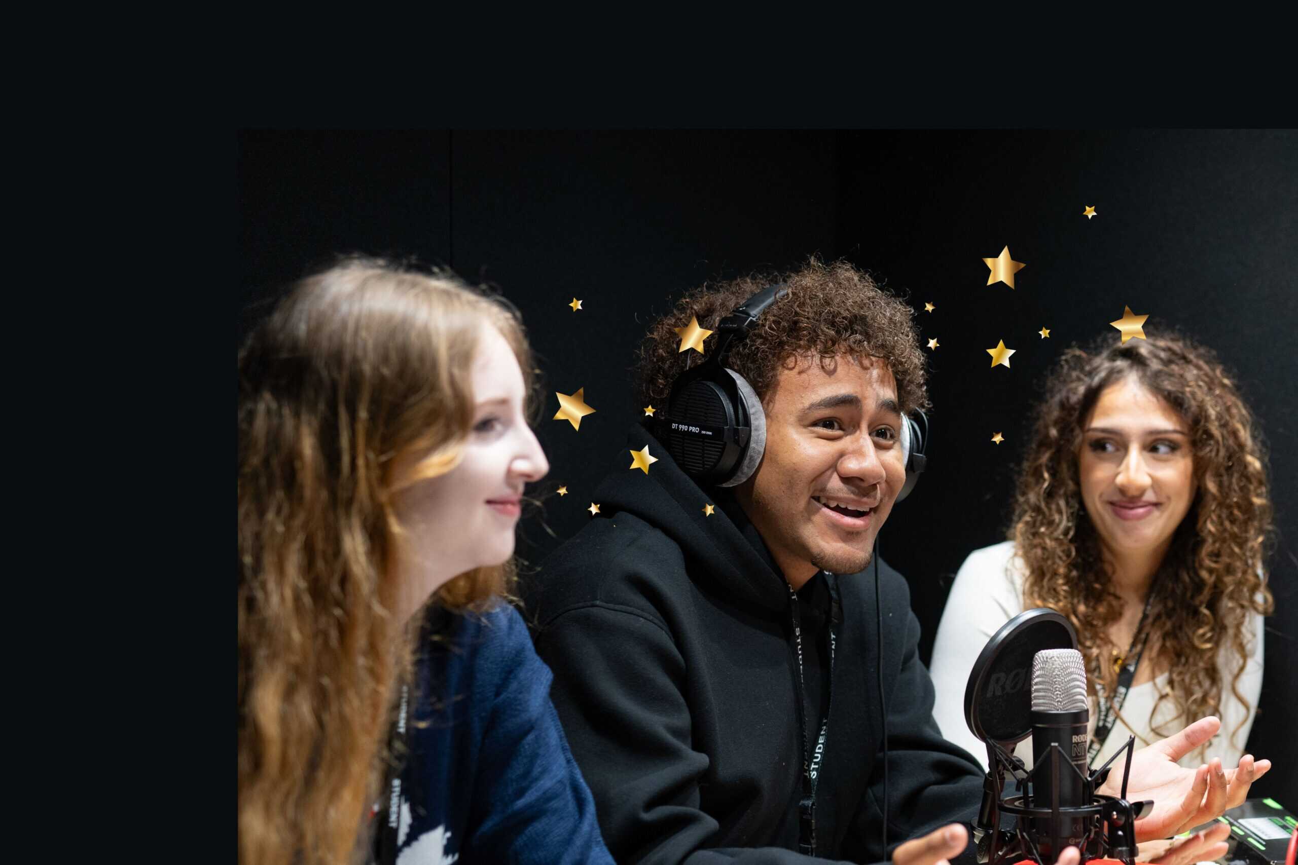 3 people laughing in a pod suite