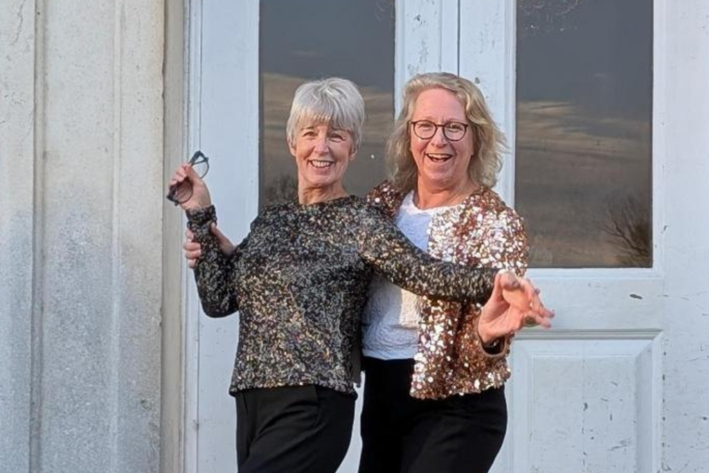 Anne Entwistle and Gillian May on the steps in front of the BCA Mansion