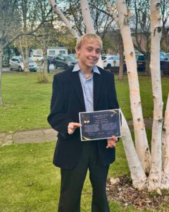 Apprentice of the Month with his certificate