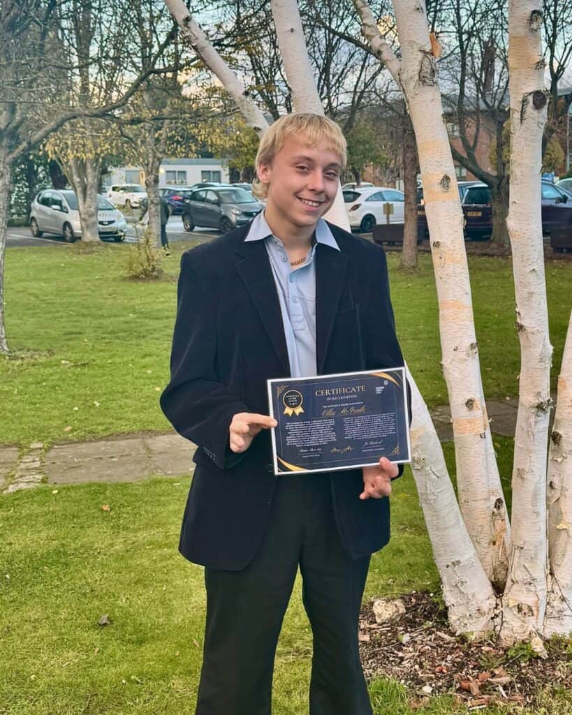 Apprentice of the Month with his certificate