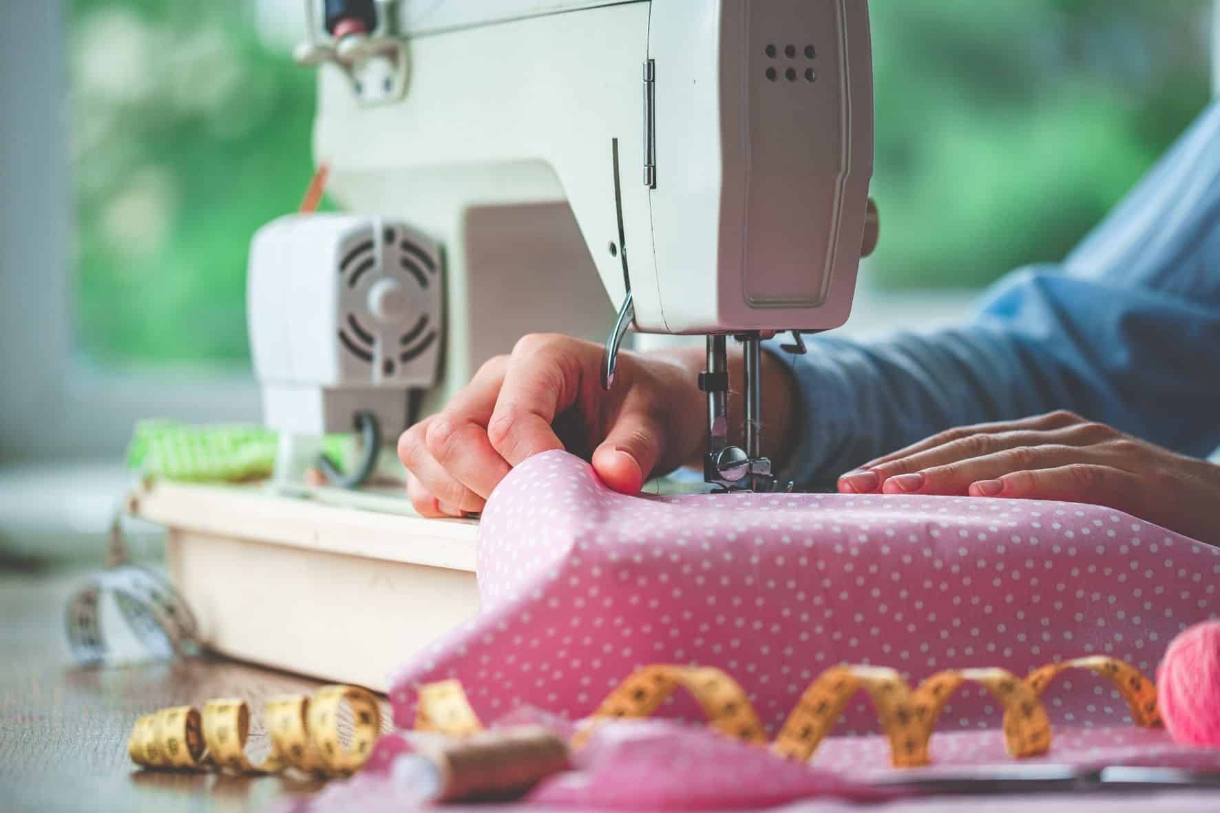 Hands on a sewing machine