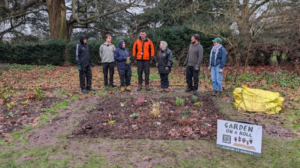 Students stood by the plants