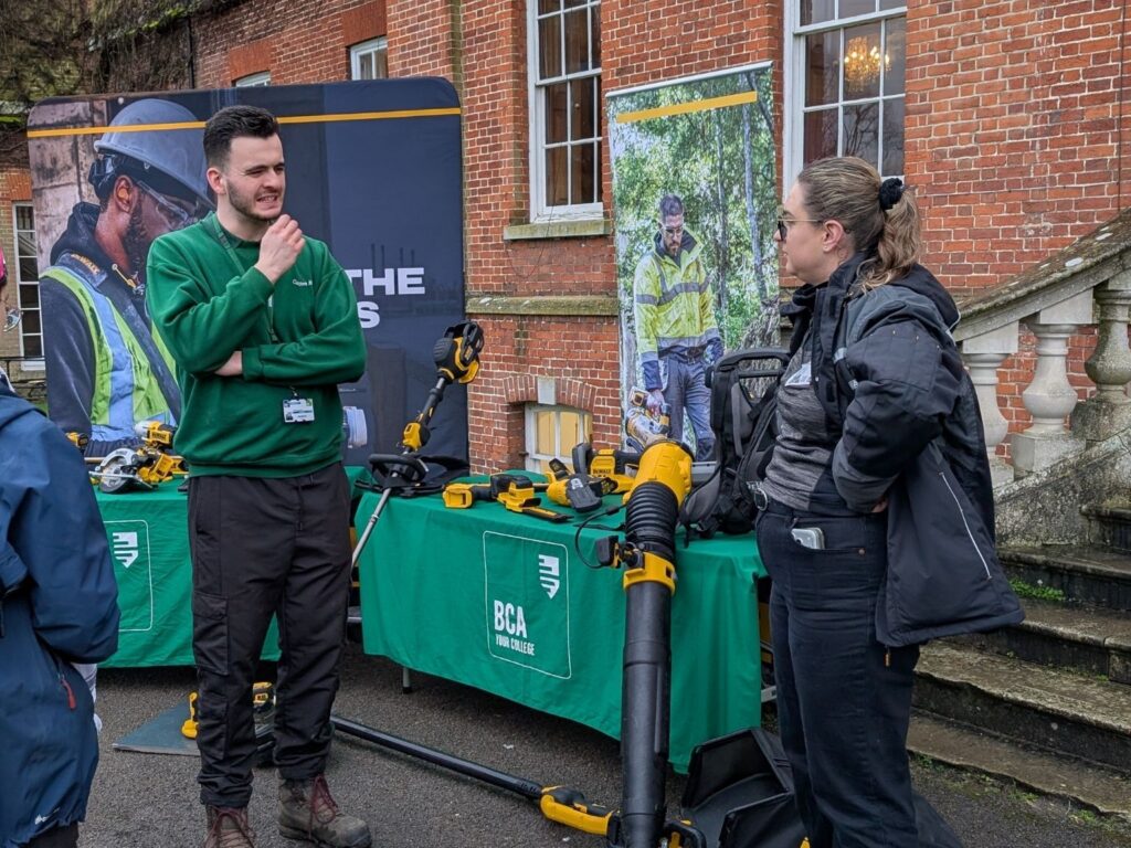 A student talking to an employer at the NAW Fair