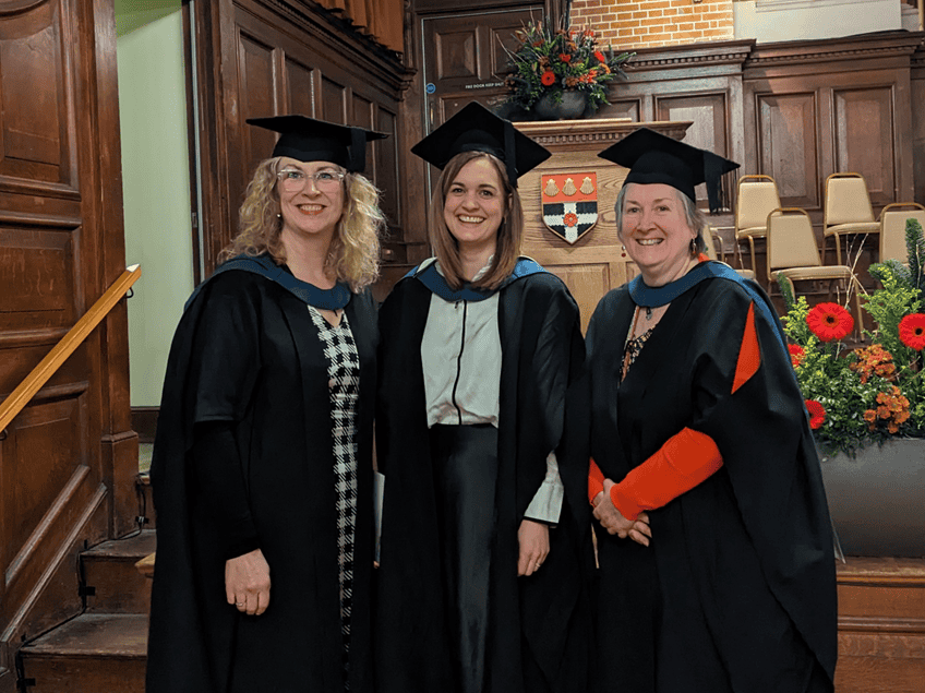Suzanna, centre, pictured alongside her two course tutors on her graduation day
