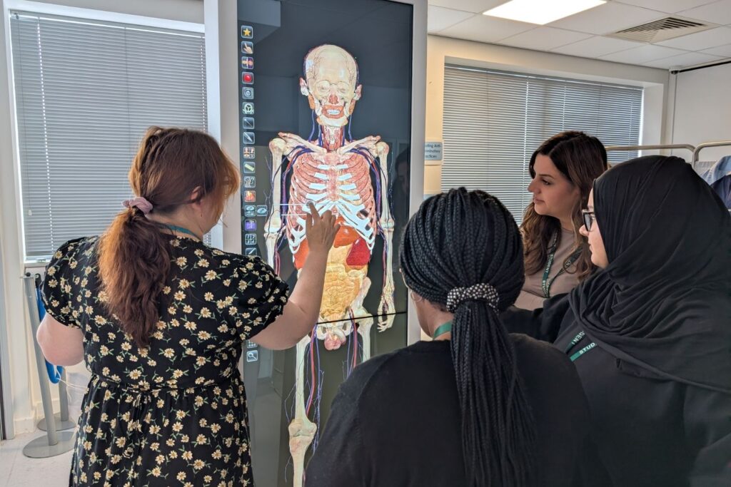 Students stood around the Anatomage Table